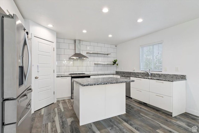15134 S White Hart Ln, Bluffdale, UT 84065 - kitchen with stainless steel appliances, wall chimney exhaust hood, tasteful backsplash, a center island, and dark stone countertops