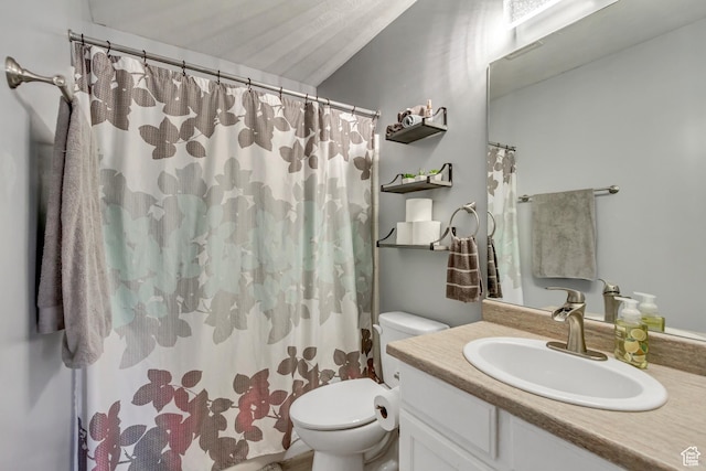 bathroom with toilet, vanity, and a shower with curtain