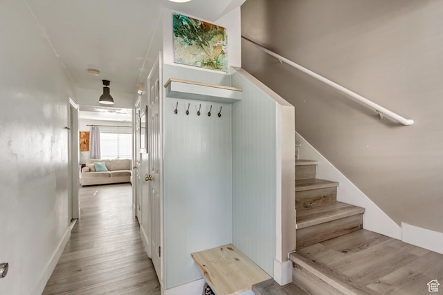 staircase featuring wood finished floors