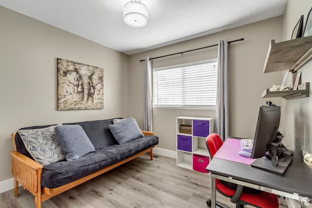 office area with wood finished floors and baseboards