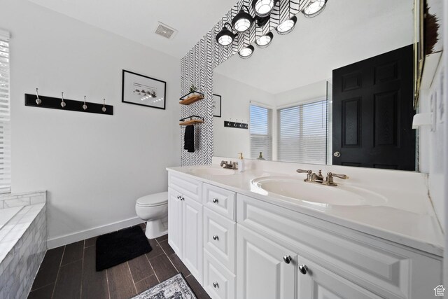 6507 S Silver Medal Dr, Taylorsville, UT 84129 - full bath featuring double vanity, toilet, and baseboards
