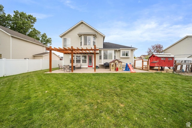 6507 S Silver Medal Dr, Taylorsville, UT 84129 - back of house featuring a shed, a pergola, a patio area, and an outbuilding