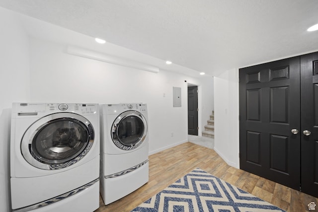 6507 S Silver Medal Dr, Taylorsville, UT 84129 - laundry room featuring electric panel, separate washer and dryer, baseboards, recessed lighting, and light wood-style floors