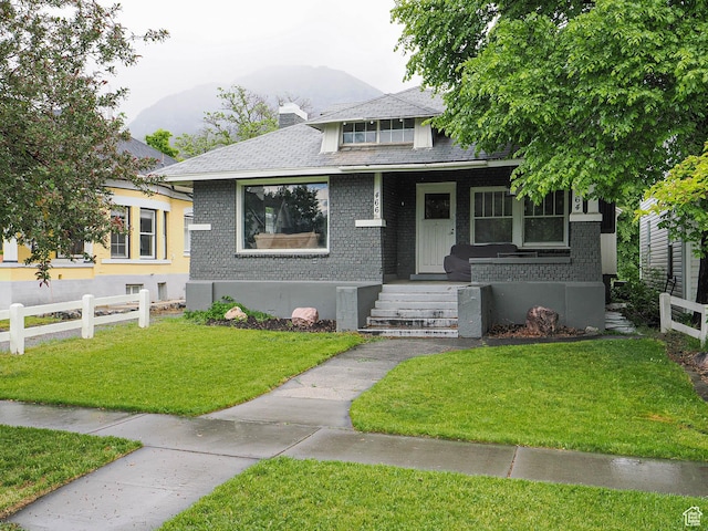 466 N 200 E, Provo, UT 84606 - bungalow with a porch, brick siding, a chimney, and a shingled roof
