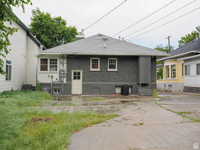 466 N 200 E, Provo, UT 84606 - rear view of property featuring roof with shingles, entry steps, central AC, and a chimney