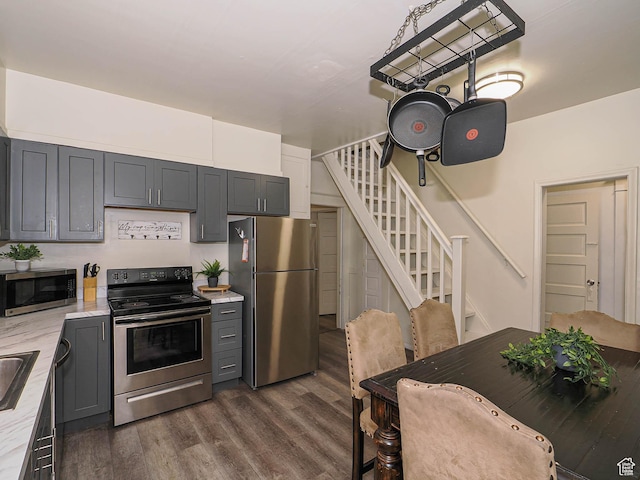 466 N 200 E, Provo, UT 84606 - kitchen with appliances with stainless steel finishes, dark wood-type flooring, light stone counters, and gray cabinets