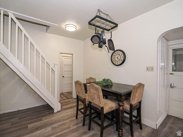 466 N 200 E, Provo, UT 84606 - dining area with stairs, dark wood-type flooring, arched walkways, and baseboards