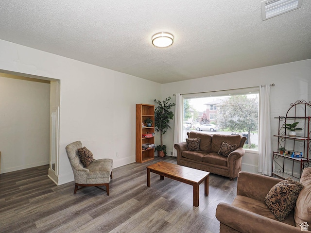 466 N 200 E, Provo, UT 84606 - living area with wood finished floors, a textured ceiling, and baseboards