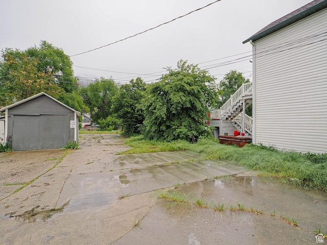 466 N 200 E, Provo, UT 84606 - view of yard with a garage, stairway, an outbuilding, and driveway