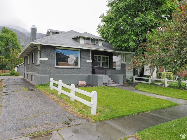 466 N 200 E, Provo, UT 84606 - bungalow with a porch, a chimney, roof with shingles, and brick siding