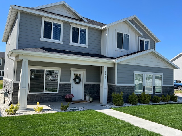 1297 W 450 N, Springville, UT 84663 - craftsman house featuring covered porch, stone siding, and a front yard