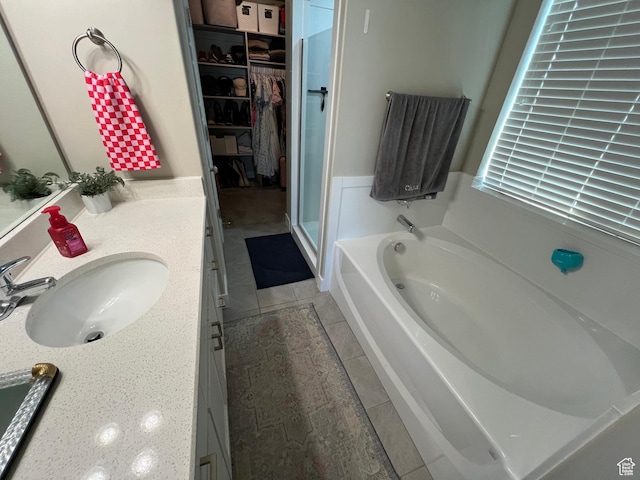 1297 W 450 N, Springville, UT 84663 - bathroom with vanity, a bath, tile patterned floors, a walk in closet, and a stall shower