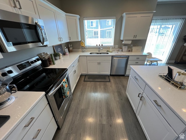1297 W 450 N, Springville, UT 84663 - kitchen with appliances with stainless steel finishes, a sink, white cabinets, and healthy amount of natural light