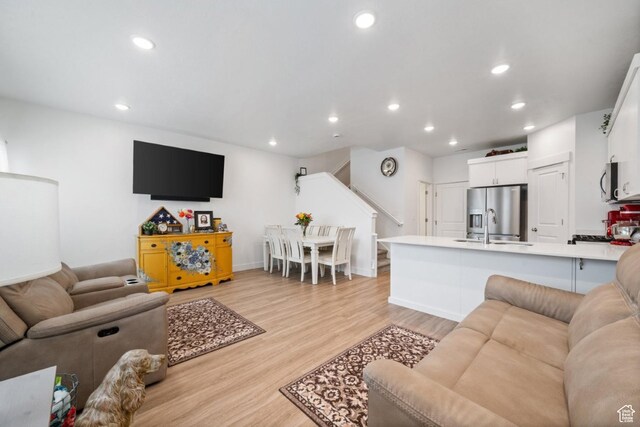 968 W 960 N Unit T3, Tremonton, UT 84337 - living area with stairway, light wood-style floors, recessed lighting, and baseboards