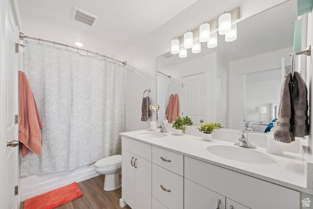 968 W 960 N Unit T3, Tremonton, UT 84337 - full bathroom featuring wood finished floors, toilet, double vanity, and shower / bath combo