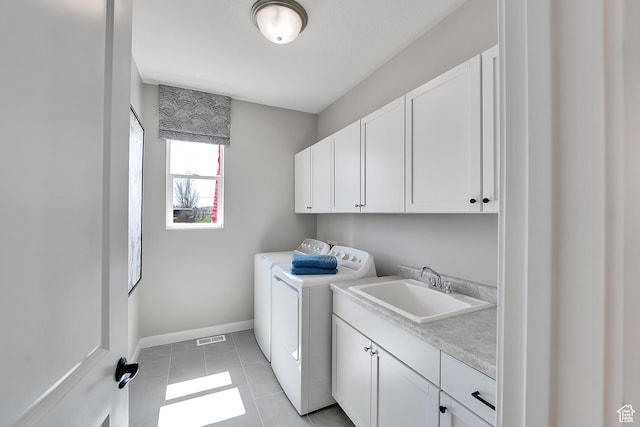 4053 W 2025 S Unit 40, Taylor, UT 84401 - washroom featuring cabinet space, independent washer and dryer, baseboards, and light tile patterned flooring