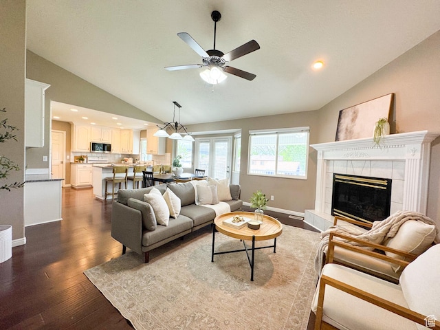 619 W 225 S, Layton, UT 84041 - living area with lofted ceiling, ceiling fan, wood finished floors, a tile fireplace, and baseboards