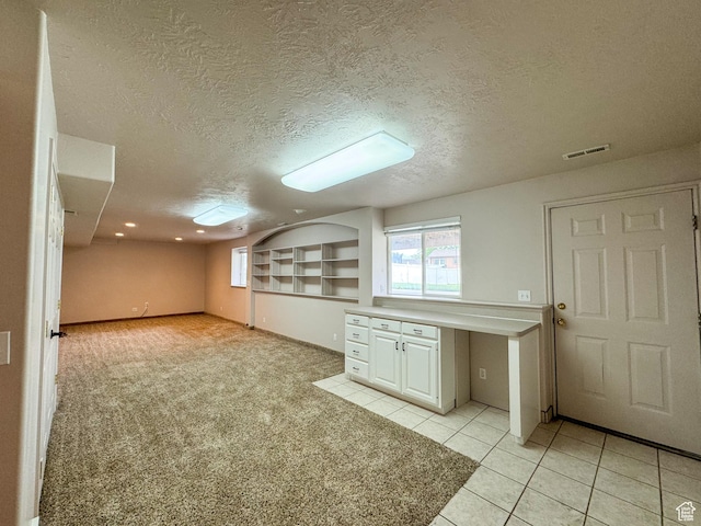 619 W 225 S, Layton, UT 84041 - basement featuring a textured ceiling, light tile patterned floors, light carpet, and recessed lighting