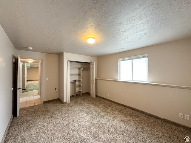 619 W 225 S, Layton, UT 84041 - unfurnished bedroom featuring a textured ceiling, a closet, light carpet, and baseboards