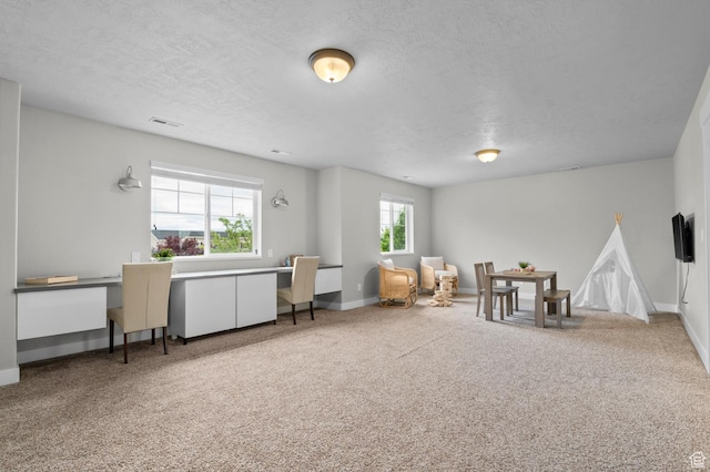2258 W Falconer Cir, Farmington, UT 84025 - sitting room featuring an office area, a textured ceiling, baseboards, and carpet floors