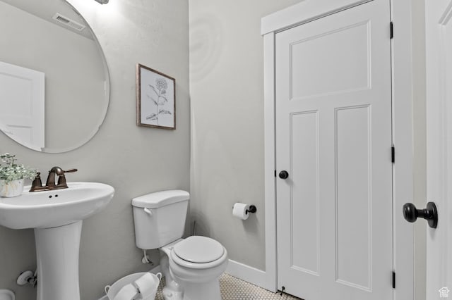 2258 W Falconer Cir, Farmington, UT 84025 - half bathroom featuring toilet, a sink, and baseboards