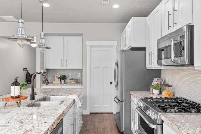 2258 W Falconer Cir, Farmington, UT 84025 - kitchen featuring stainless steel appliances, a sink, white cabinetry, dark wood-type flooring, and recessed lighting