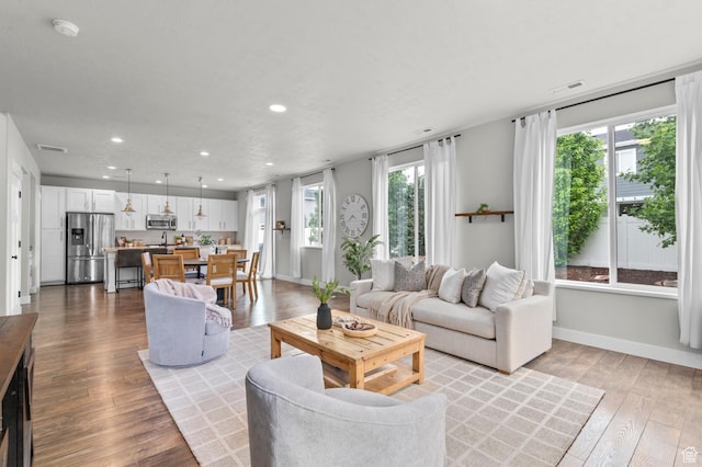 2258 W Falconer Cir, Farmington, UT 84025 - living room with recessed lighting, hardwood / wood-style floors, and baseboards