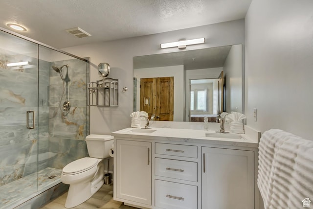 6641 N 2200 W Unit D-304, Park City, UT 84098 - bathroom featuring toilet, a marble finish shower, double vanity, and wood finished floors
