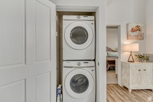 6641 N 2200 W Unit D-304, Park City, UT 84098 - laundry room with stacked washer and clothes dryer and light wood-style floors