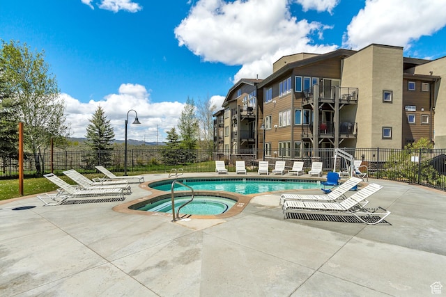 6641 N 2200 W Unit D-304, Park City, UT 84098 - community pool featuring a community hot tub and a patio area