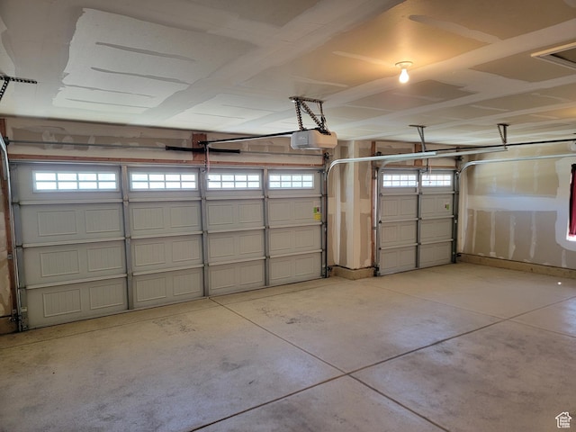 garage featuring a garage door opener