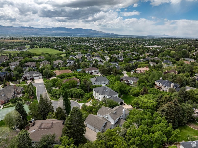aerial view of residential area featuring mountains