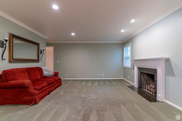 carpeted living room featuring a fireplace with flush hearth, baseboards, ornamental molding, and recessed lighting