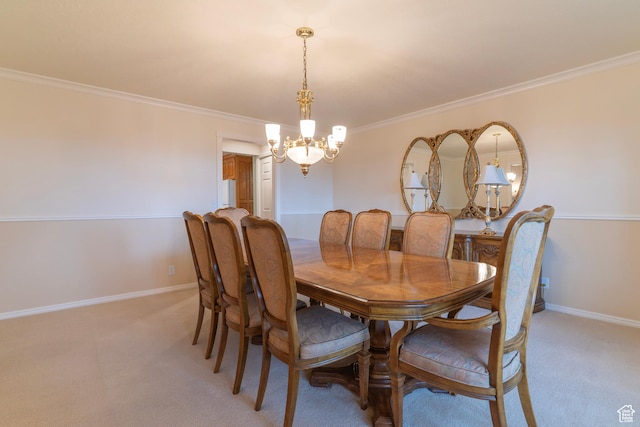 dining room with a chandelier, light carpet, crown molding, and baseboards