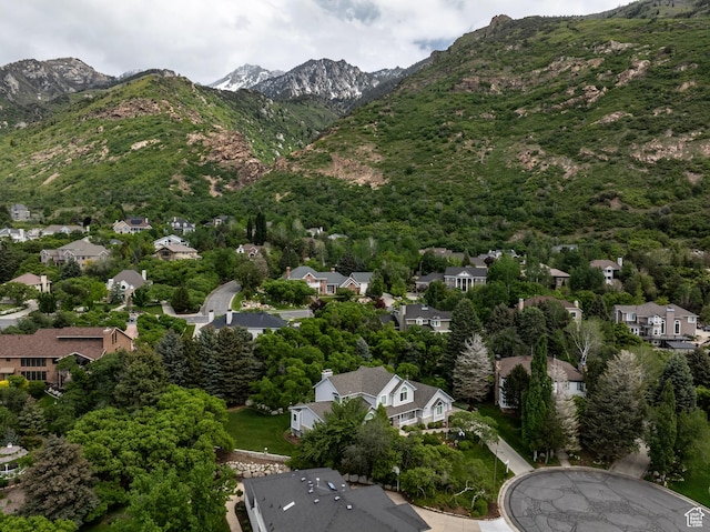 aerial view of property's location featuring mountains and nearby suburban area
