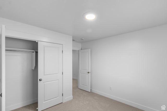 651 W 575 N, Smithfield, UT 84335 - unfurnished bedroom with light carpet, baseboards, and a closet
