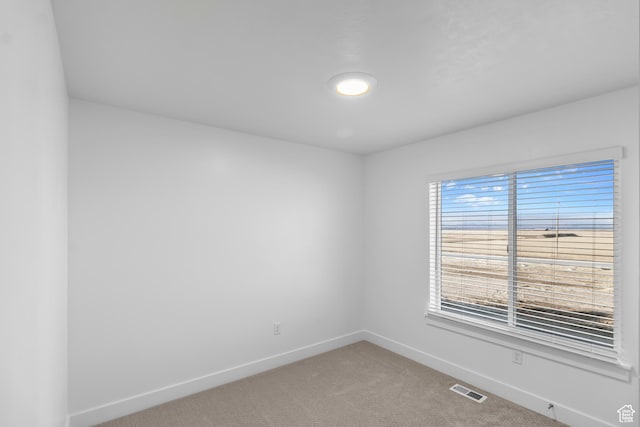651 W 575 N, Smithfield, UT 84335 - spare room featuring baseboards and light carpet