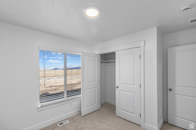 651 W 575 N, Smithfield, UT 84335 - unfurnished bedroom with light colored carpet, baseboards, and a closet