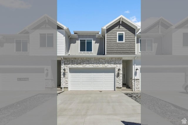 651 W 575 N, Smithfield, UT 84335 - view of front of property with an attached garage, board and batten siding, stone siding, and driveway