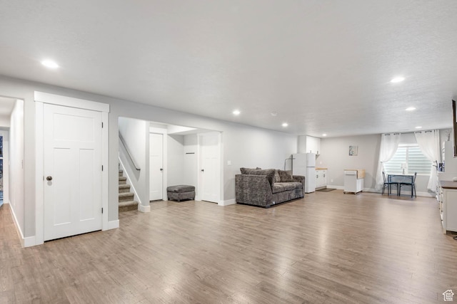 541 W 1960 N, Tooele, UT 84074 - living area with stairway, recessed lighting, wood finished floors, and baseboards