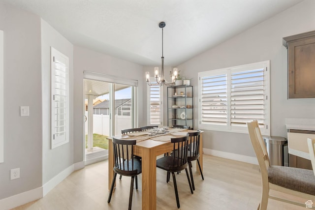 541 W 1960 N, Tooele, UT 84074 - dining area featuring a chandelier, baseboards, and light wood-type flooring