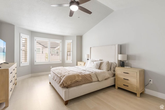 541 W 1960 N, Tooele, UT 84074 - bedroom featuring light wood-style flooring, lofted ceiling, baseboards, a textured ceiling, and a ceiling fan