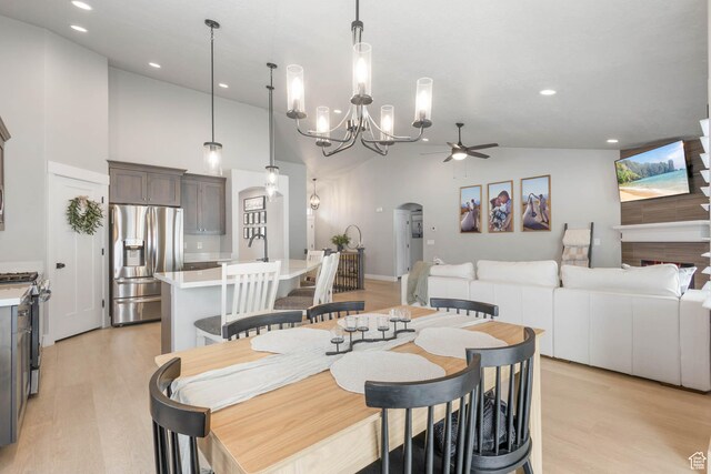 541 W 1960 N, Tooele, UT 84074 - dining room with ceiling fan, light wood-style floors, arched walkways, recessed lighting, and a chandelier