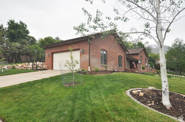 view of front of house with brick siding, concrete driveway, an attached garage, and a front lawn