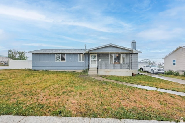 396 S 100 E, Tooele, UT 84074 - view of front facade with covered porch, board and batten siding, and a chimney