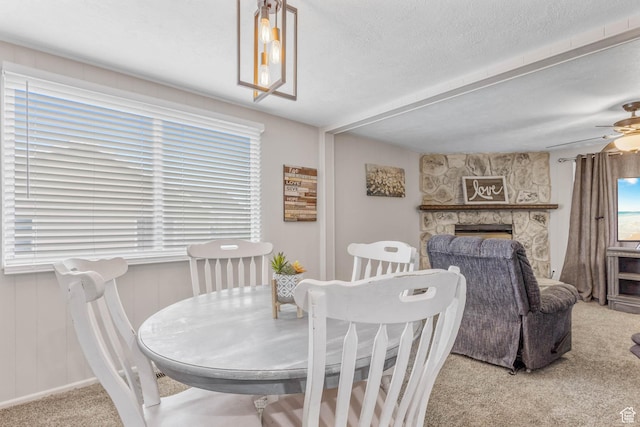 396 S 100 E, Tooele, UT 84074 - carpeted dining space with a fireplace and a ceiling fan