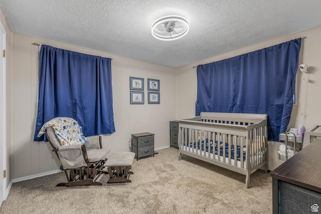 396 S 100 E, Tooele, UT 84074 - bedroom with a textured ceiling, carpet, a crib, and baseboards