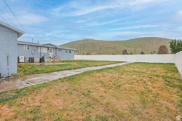 396 S 100 E, Tooele, UT 84074 - view of yard with a mountain view and central AC unit