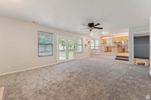4948 S 1150 E, Ogden, UT 84403 - unfurnished living room with ceiling fan, carpet, and baseboards