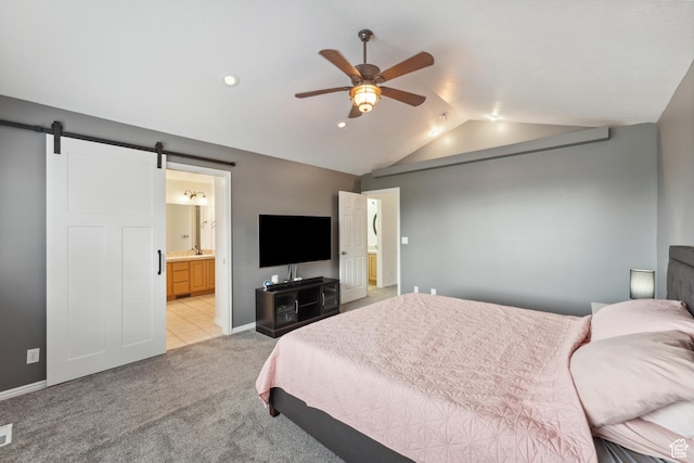 4948 S 1150 E, Ogden, UT 84403 - bedroom with lofted ceiling, a barn door, light carpet, connected bathroom, and baseboards